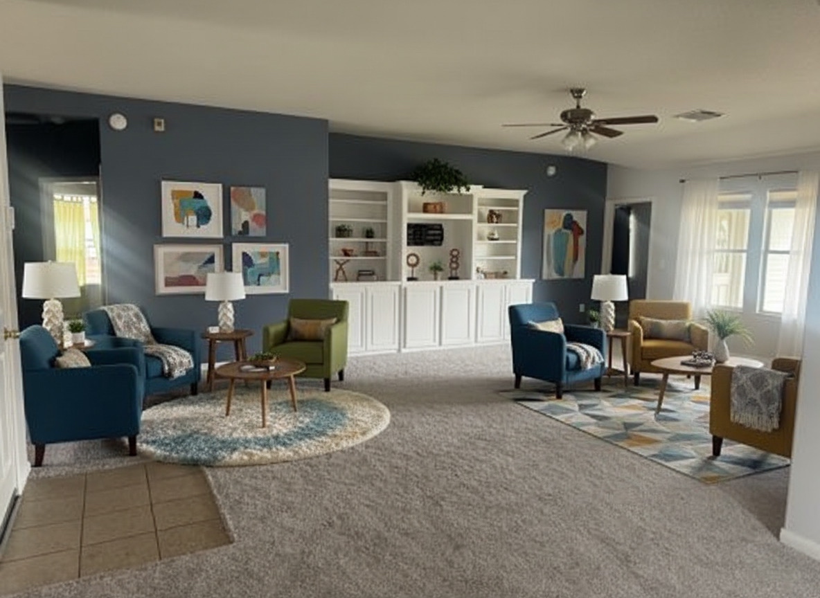 Staged living room with warm seating and community feel